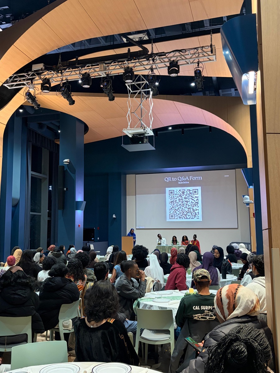 A full room of guests at the second Night Out for Sudan, with speakers on stage